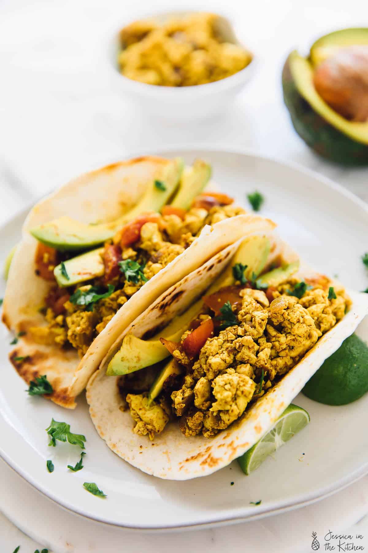 Tofu scramble loaded into two tortillas. 