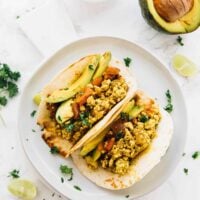 Overhead shot of tofu scramble in soft tortillas.