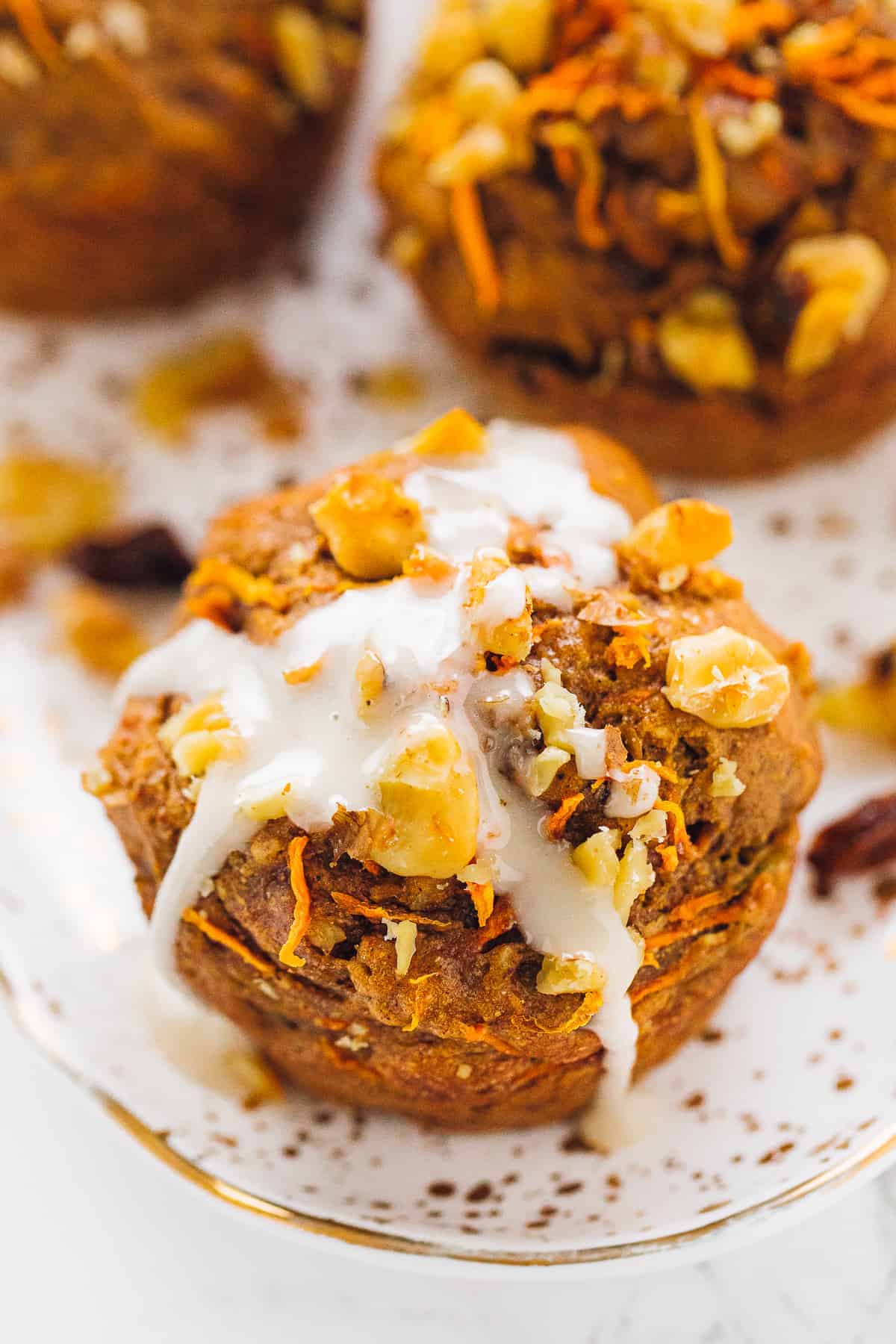 closeup shot of carrot cake muffin with icing