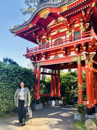 Jessica next to a pagoda.