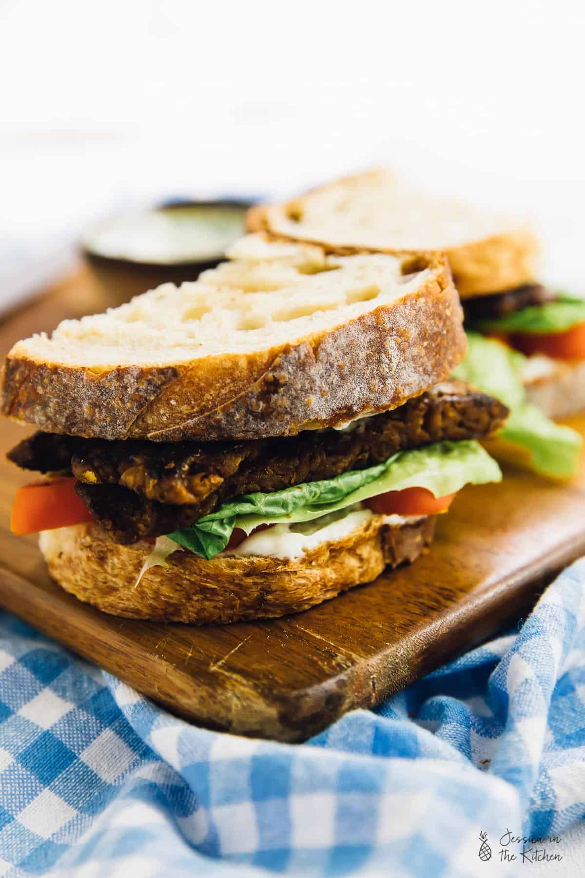 Vegan blt sandwich sliced in half.