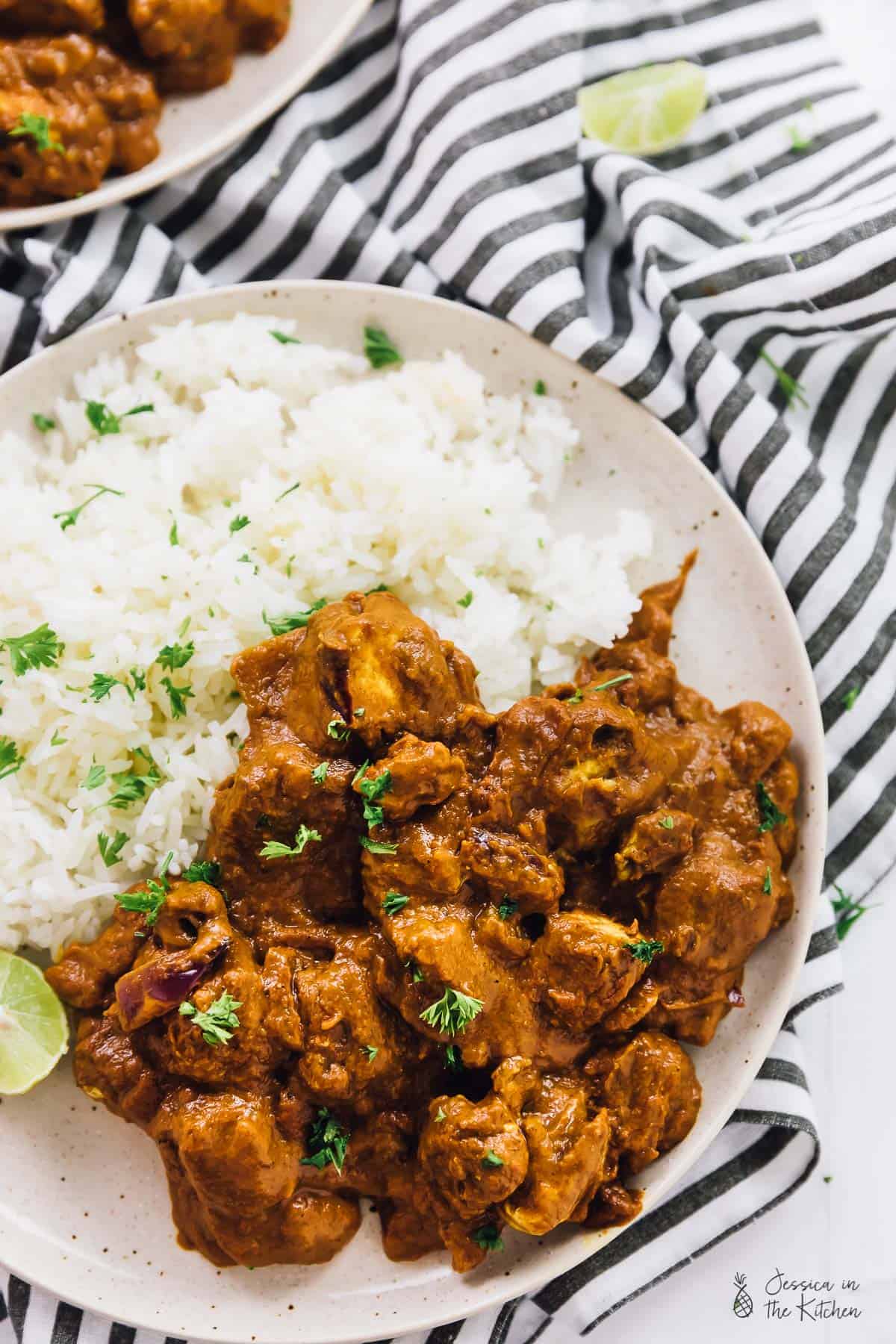 Vegan butter chicken on a plate with rice. 