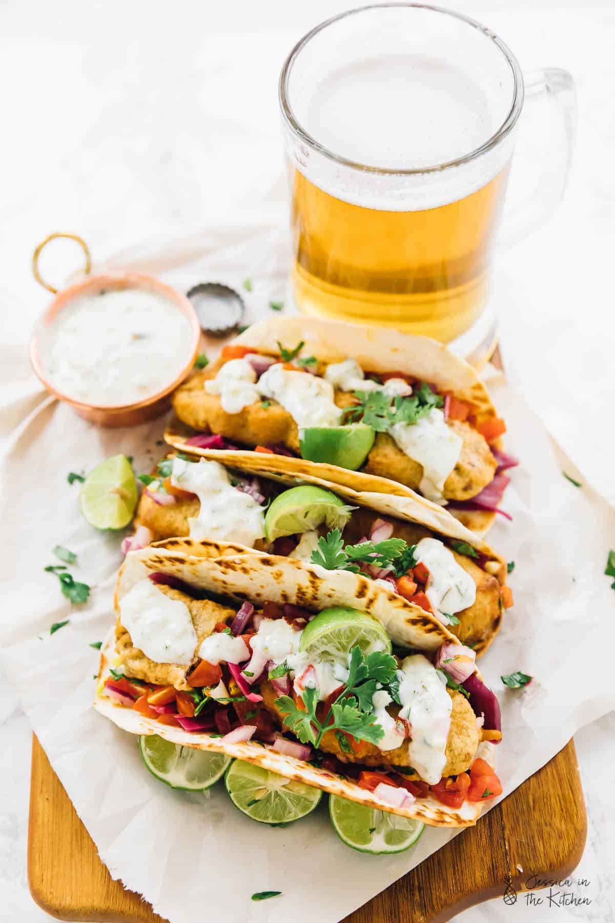 This Vegan Fish Tacos are a real vegan treat!! A beer-battered crust, flavourful pico de gallo and a creamy tartar sauce make for the ultimate vegan taco experience! via https://jessicainthekitchen.com 