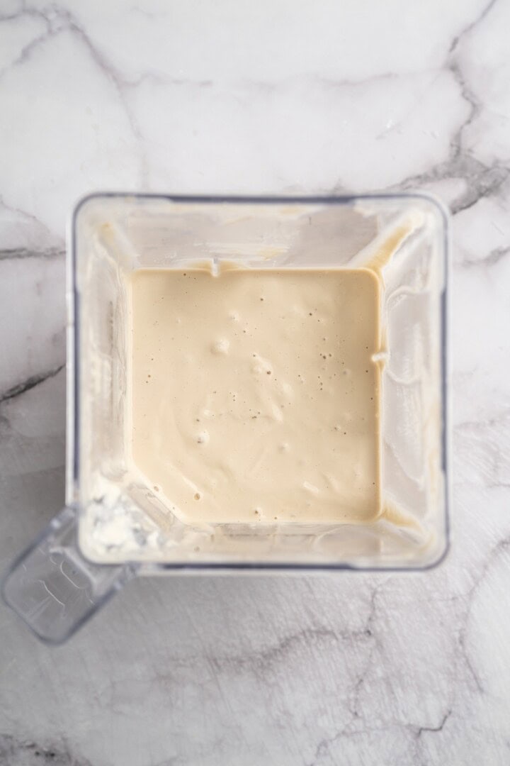 Overhead view of cashew alfredo sauce in blender
