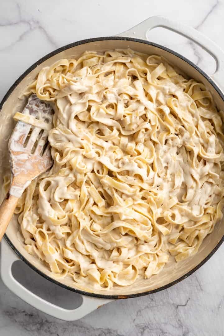 Overhead view of vegan garlic Alfredo pasta in skillet
