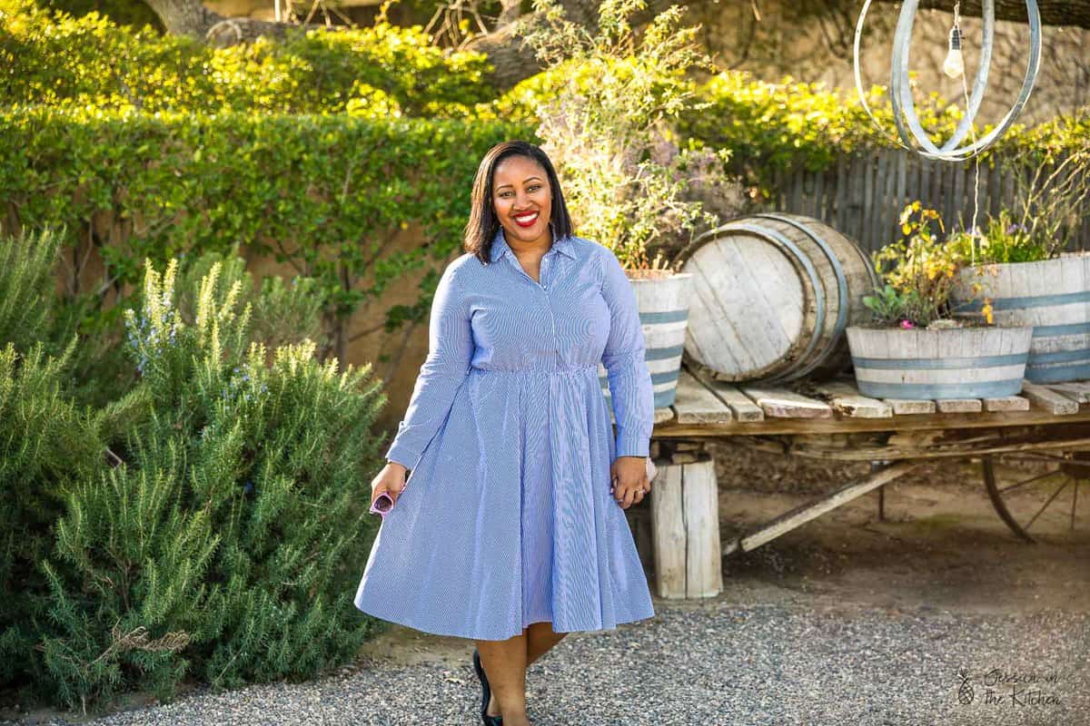 Jessica outside in a blue dress.