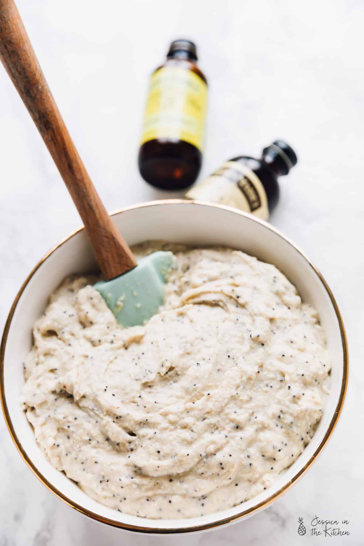 Waffle batter being mixed in a bowl.