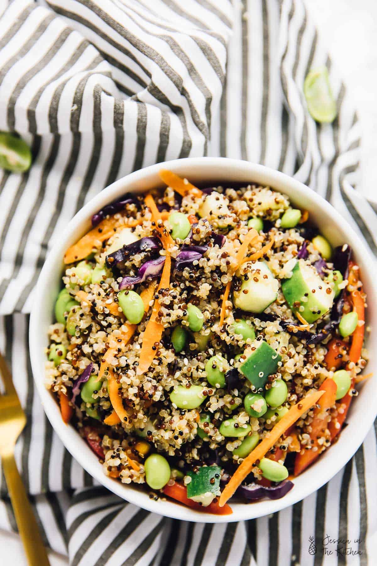 Asian quinoa salad in white bowl