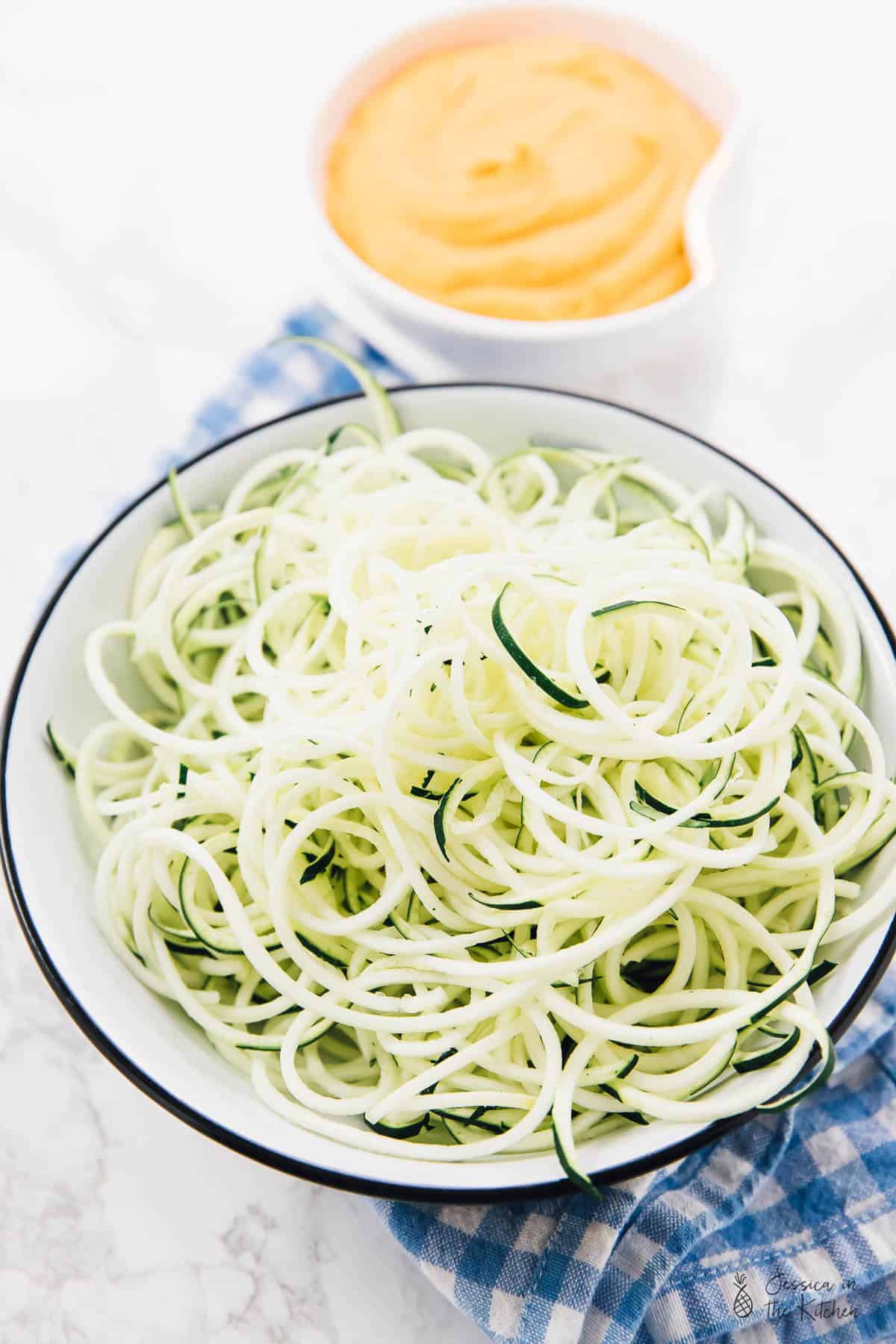 Close up of a bowl of zucchini noodles. 
