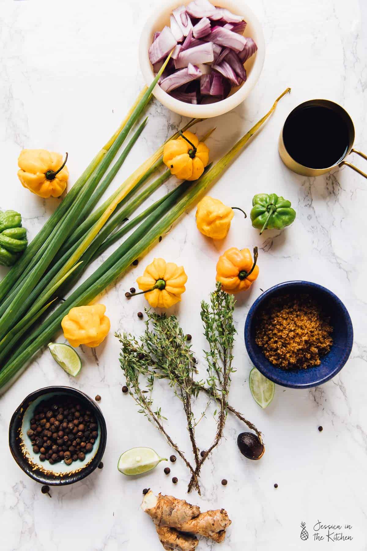 Jamaica Jerk Sauce ingredients including scotch bonnet peppers scallion thyme and other spices.