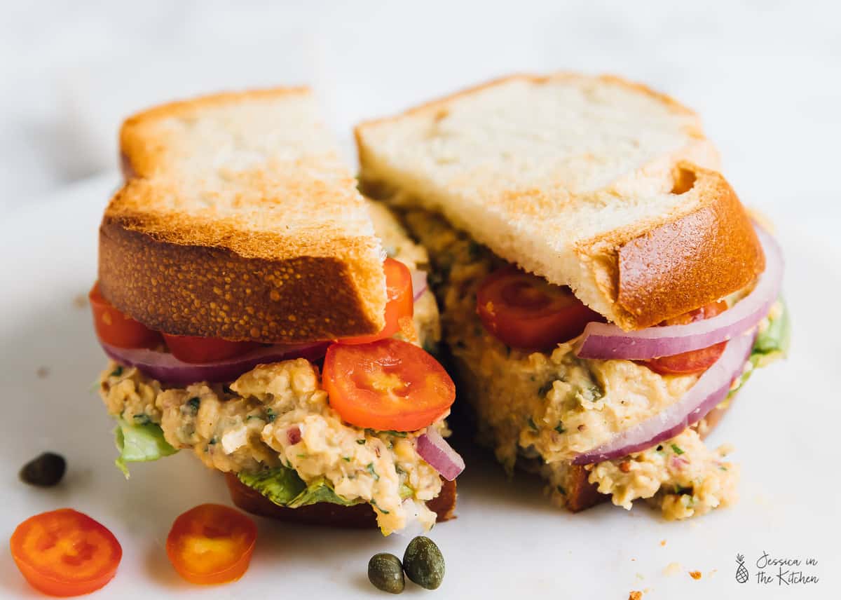 Close up shot of a sliced vegan tuna sandwich.