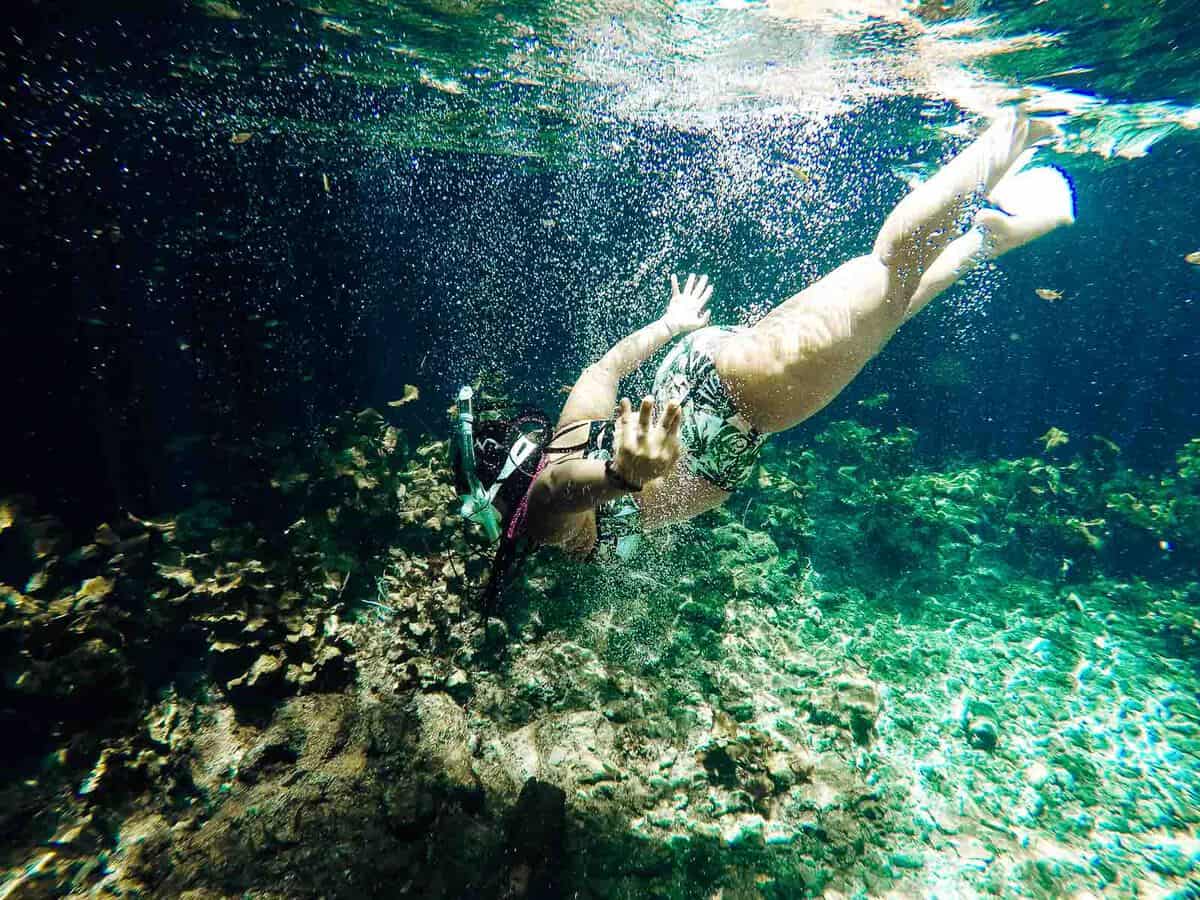 Jessica swimming underwater, with a snorkel.