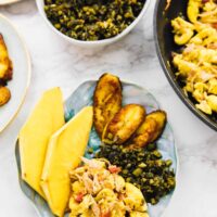 Top down shot of vegan ackee and saltfish on a blue plate.