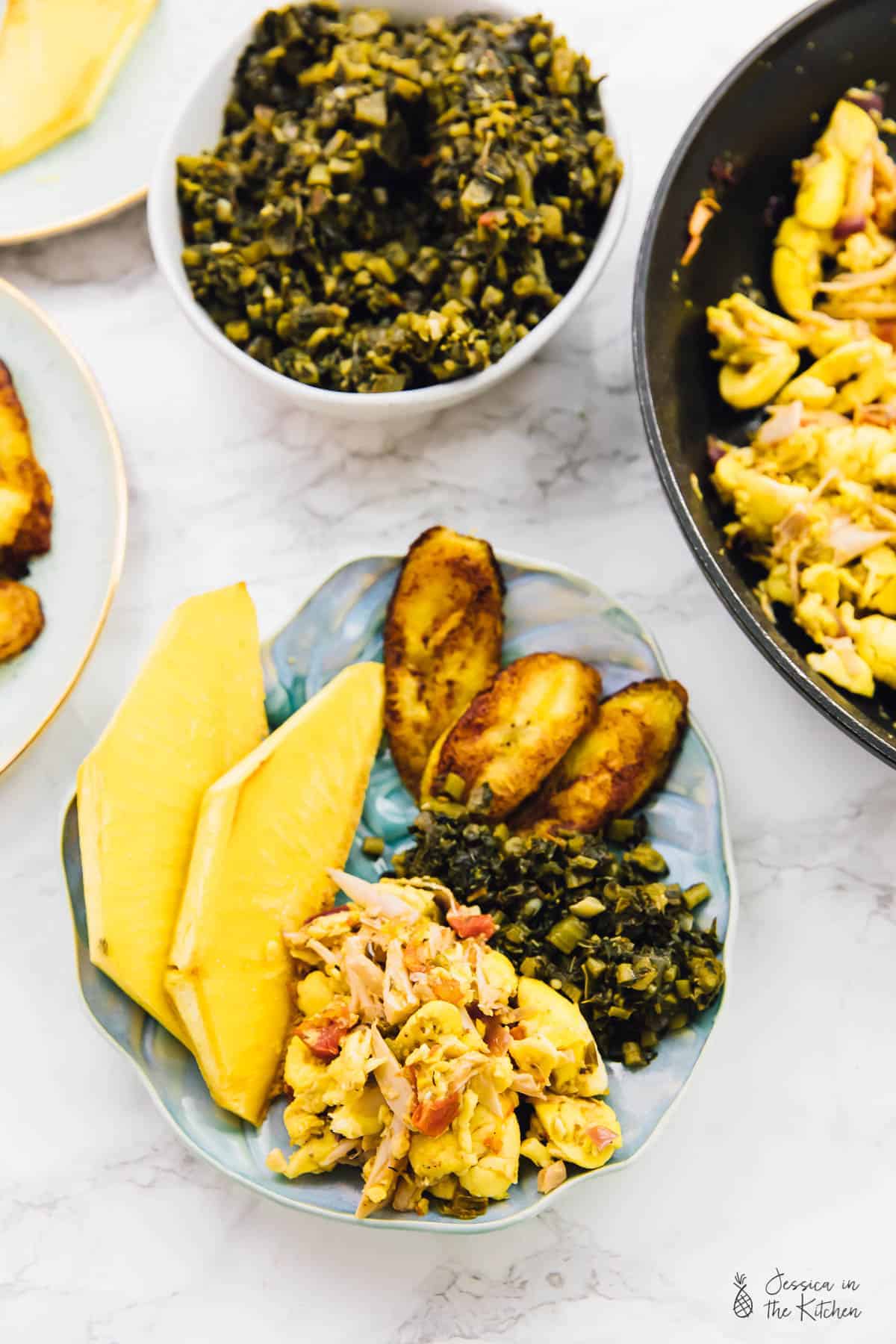 Top down view of vegan ackee and saltfish, on a blue plate. 