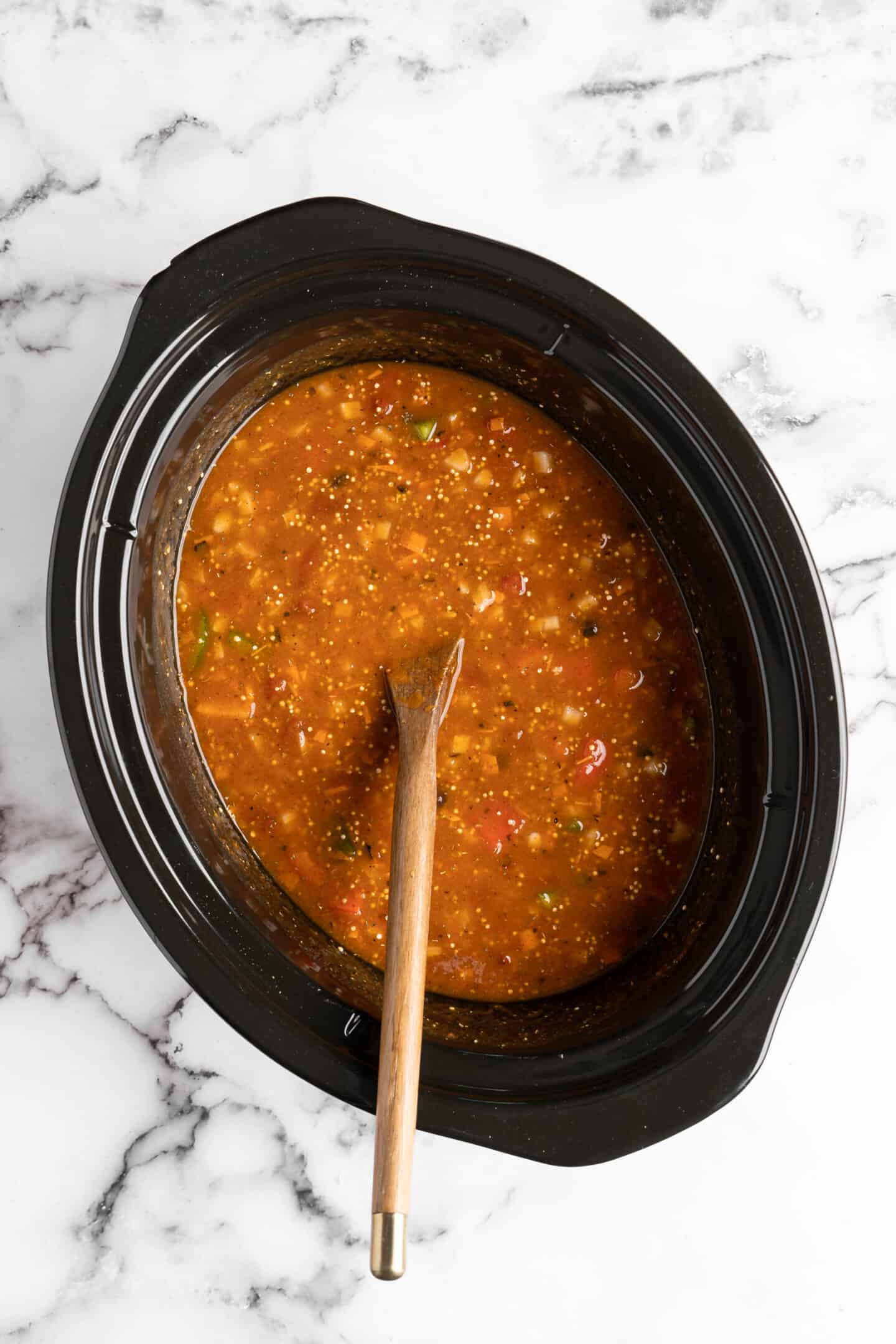 Pumpkin chili cooking in a slow cooker