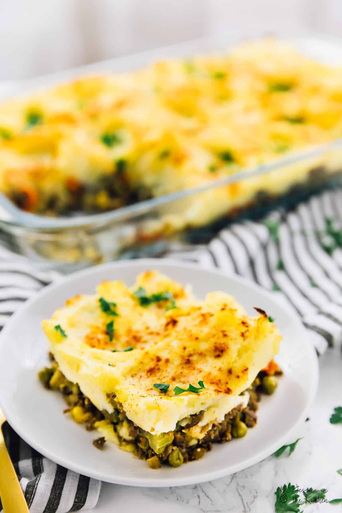 A portion of vegan shepherd's pie on a white plate. 