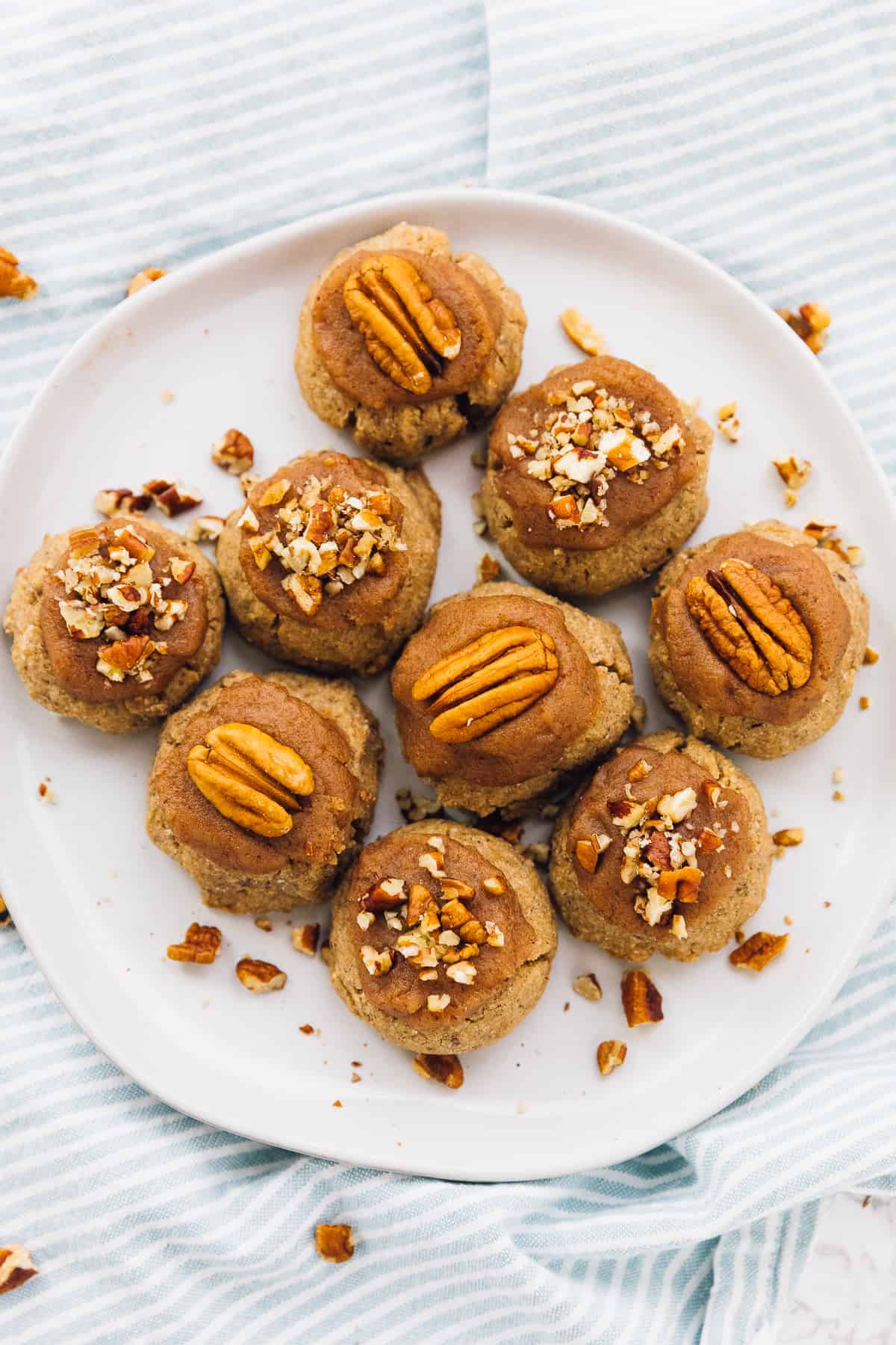 closeup shot of maple pecan cookies laying on a white plate