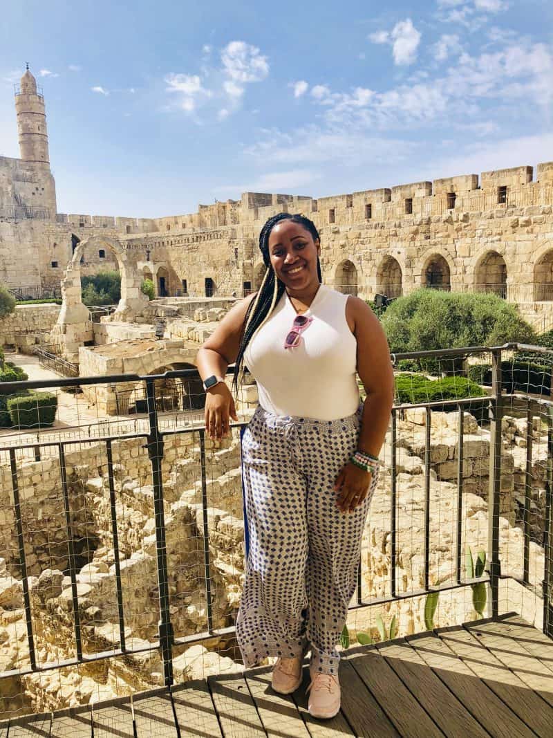 Jessica standing on a courtyard in jerusalem.