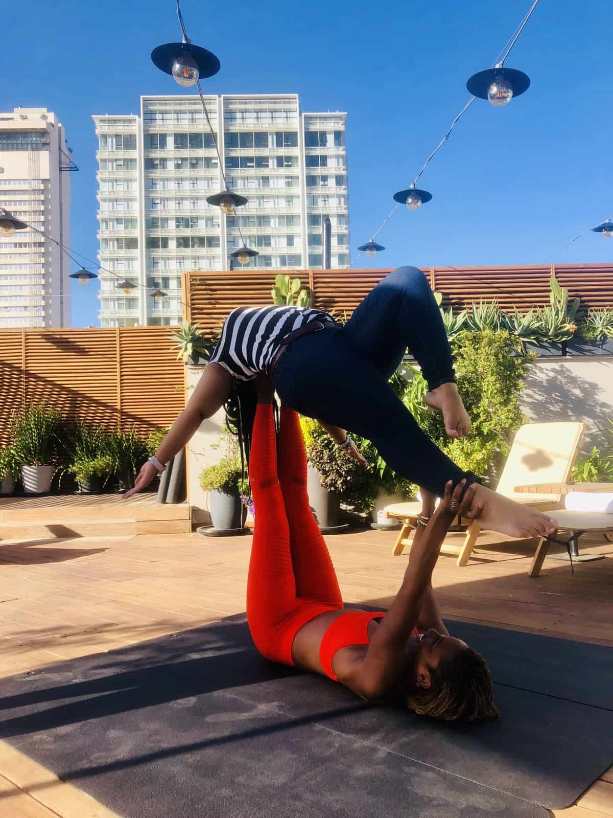 Jessica doing yoga with a friend. 
