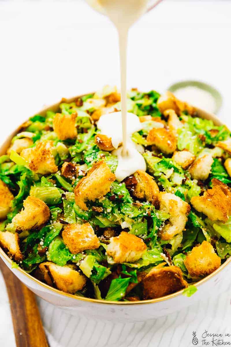 This Vegan Caesar Salad is perfect for a crowd-pleasing dish! Its made with a tangy creamy dressing thats the perfect vegan re-make of the classic, crunchy croutons and crisp romaine lettuce! Its bound to be a new favourite in your household. via https://jessicainthekitchen.com