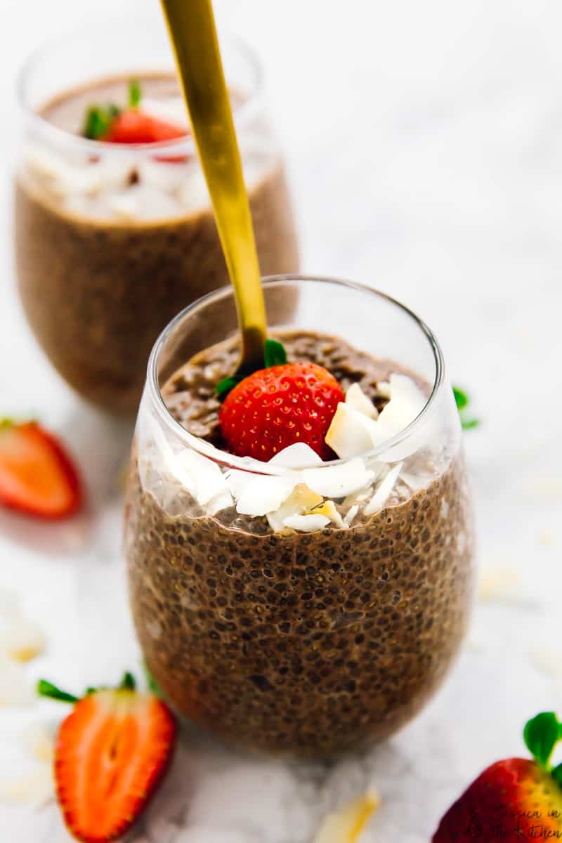 Close up of  chocolate chia pudding in round glasses.