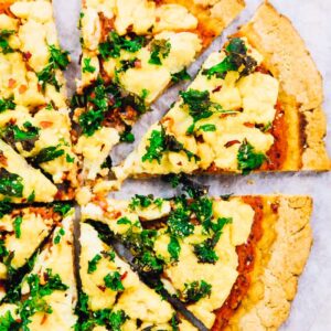 Top down view of a sliced vegan pizza.