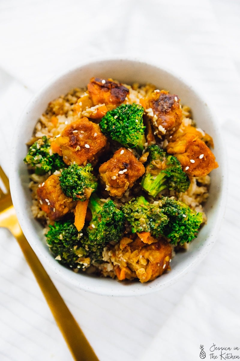 Overhead shot of tempeh stir fry with broccoli in a bowl. 