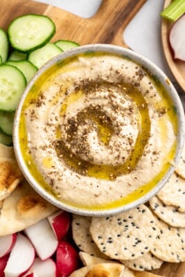 Overhead view of roasted cauliflower hummus with olive oil and za'atar
