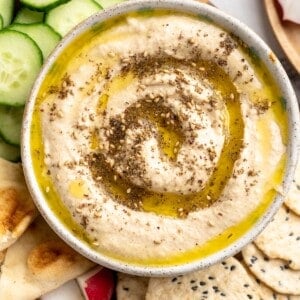 Overhead view of roasted cauliflower hummus with olive oil and za'atar