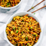 Overhead view of two bowls of vegan quinoa fried rice