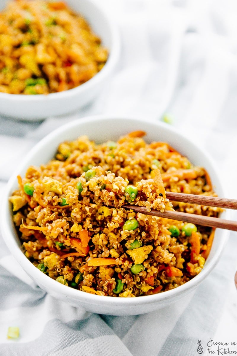 Vegan quinoa fried rice in a chopstick.