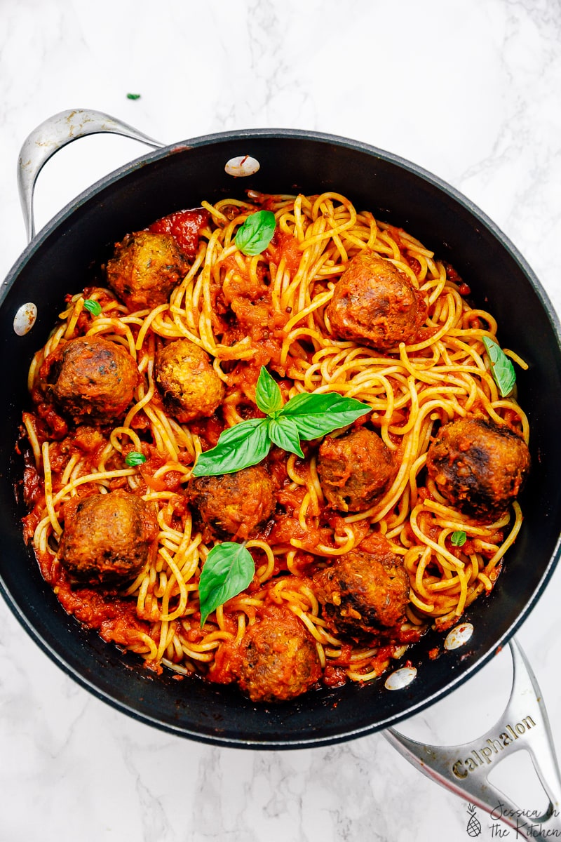 Vegan spaghetti and meatballs in a pot flatlay shot.