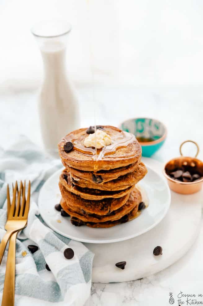 A stack of vegan chocolate chip pancakes on a plate.