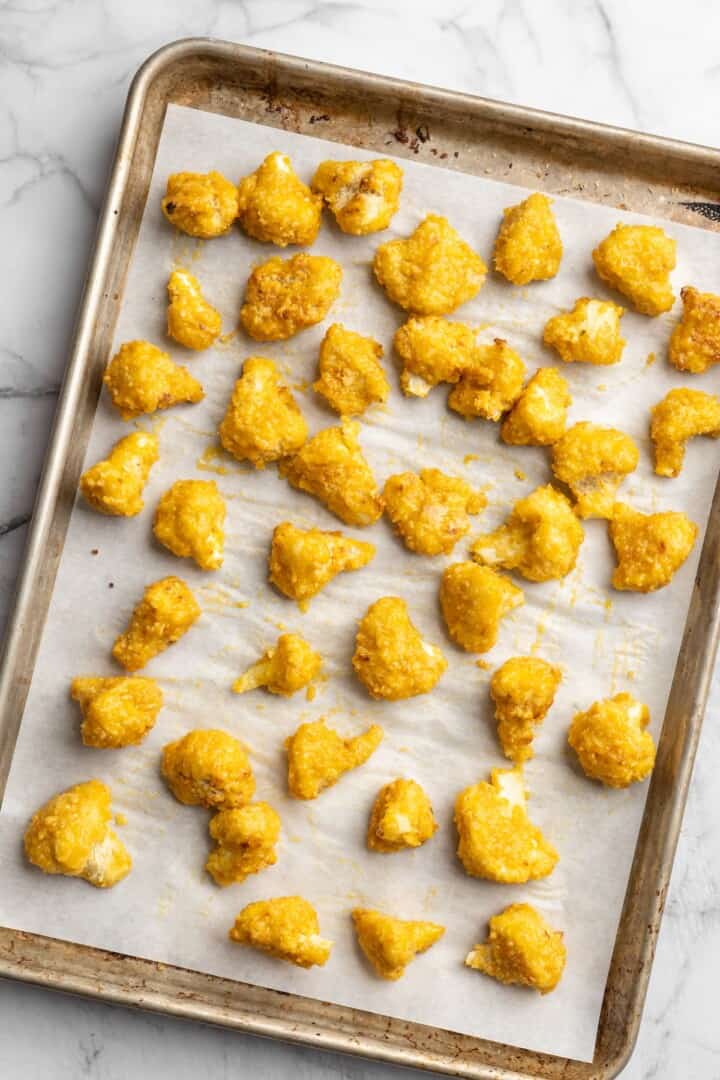 Overhead view of mango habanero cauliflower wings on sheet pan