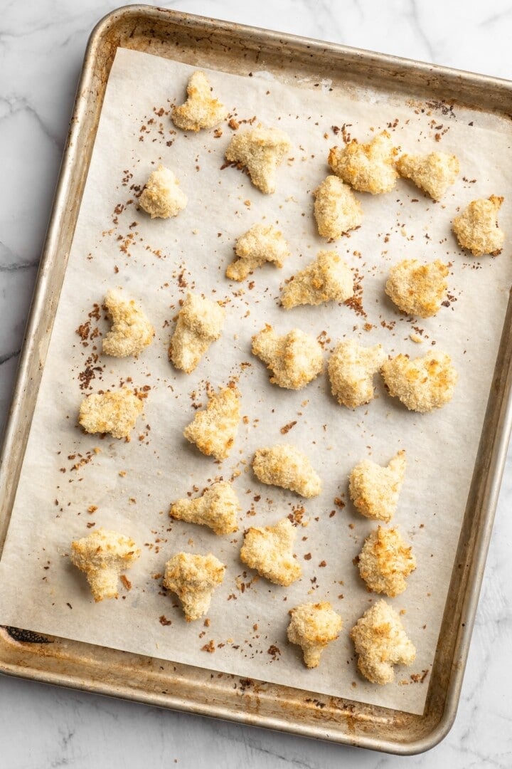 Overhead view of cauliflower on sheet pan before adding sauce
