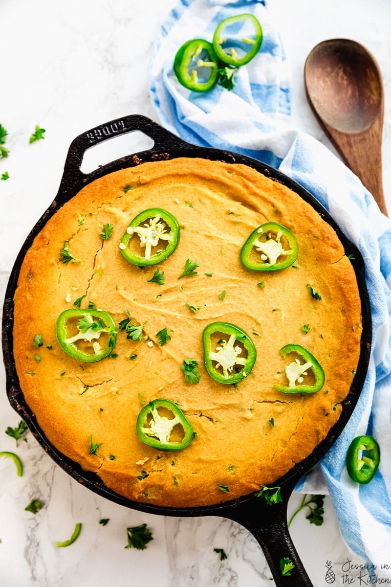 Top down view of vegan chili cornbread in a skillet. 