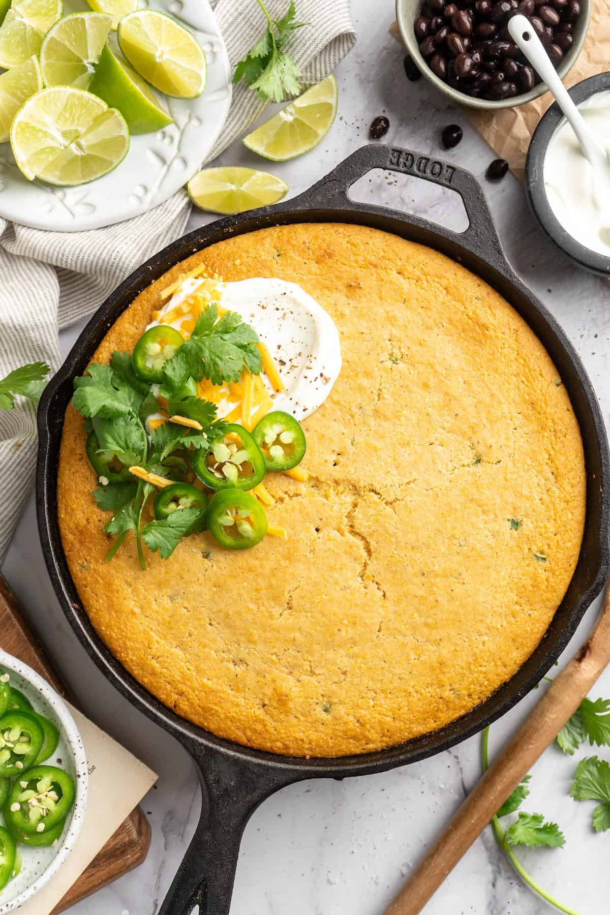 This vegan chili cornbread casserole is one of the BEST casseroles ever! The secret? Sweet, crispy cornbread baked on top of delicious chili. Overhead view of vegan chili cornbread casserole