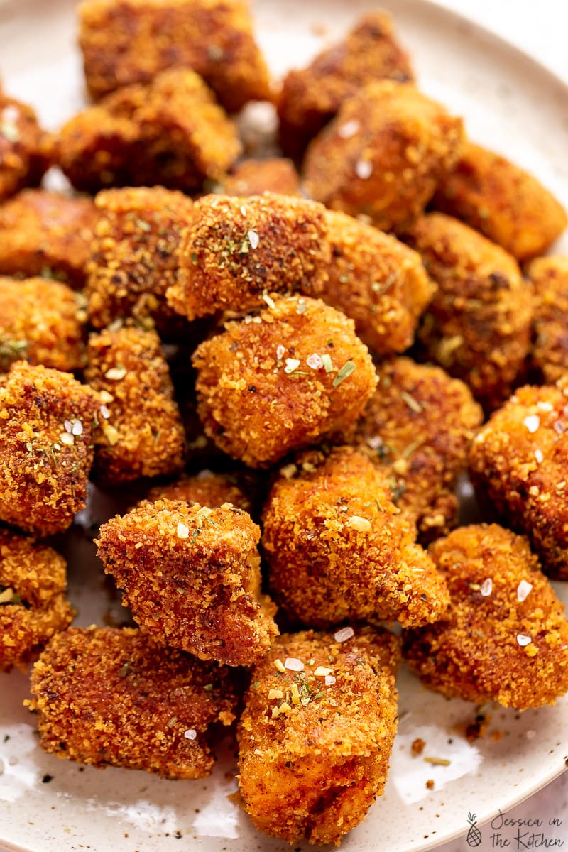 Vegan chicken nuggets on a plate, close up.