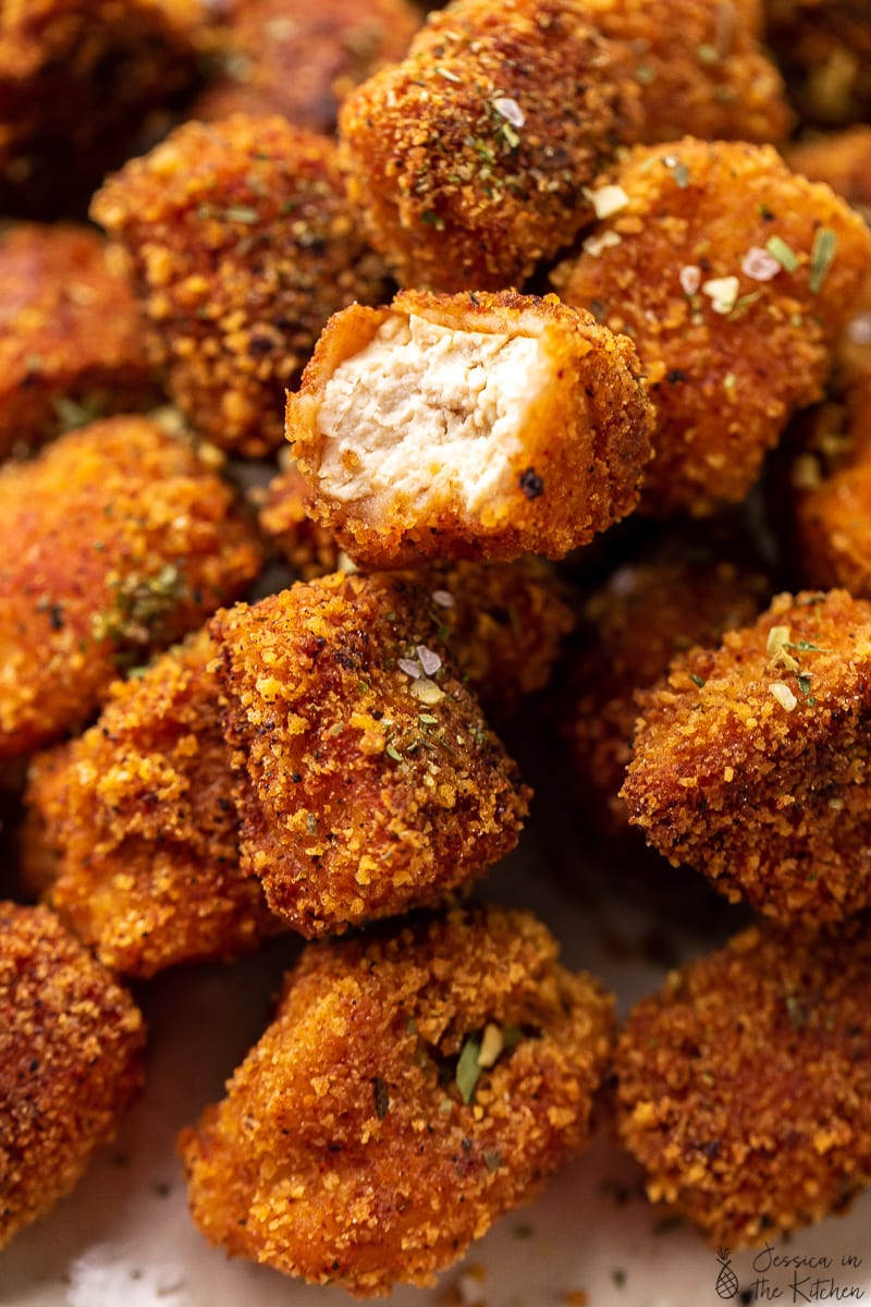 Chicken Strips Or Nuggets Being Deep-fried In A Cast-iron Frying