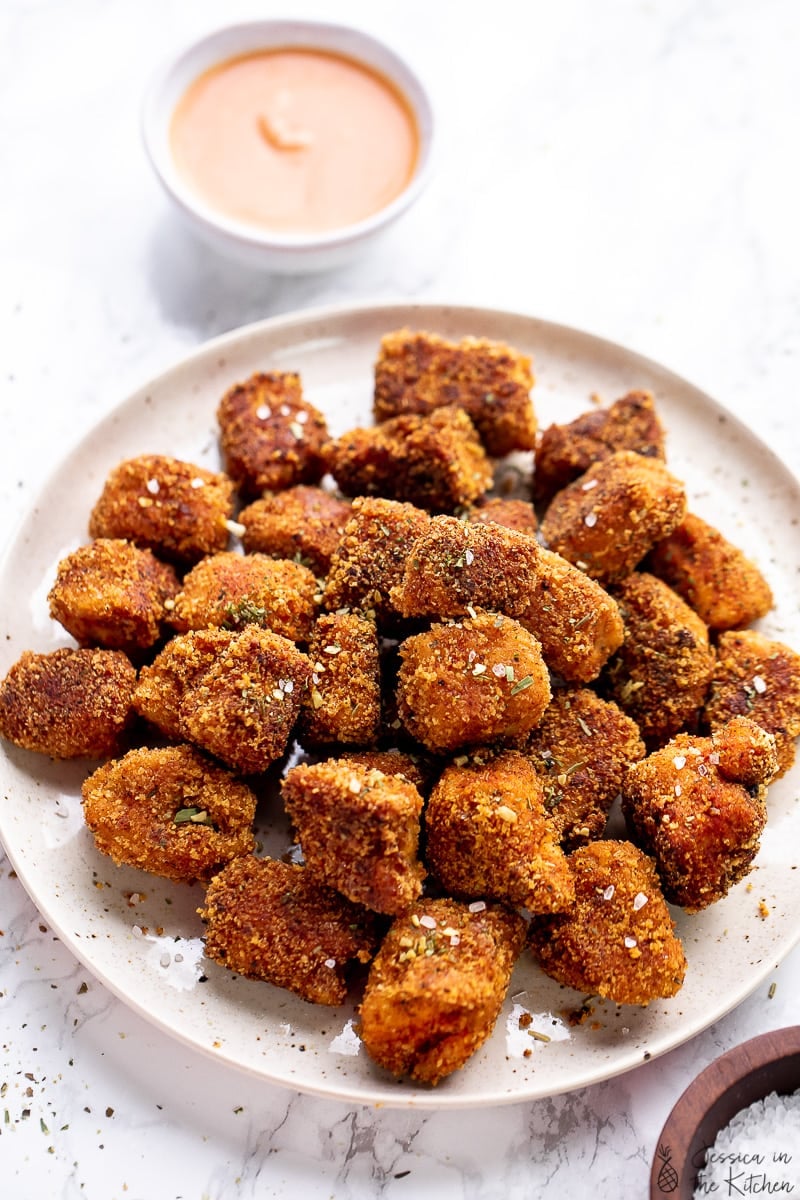 Vegan chicken nuggets made with tofu on a plate.
