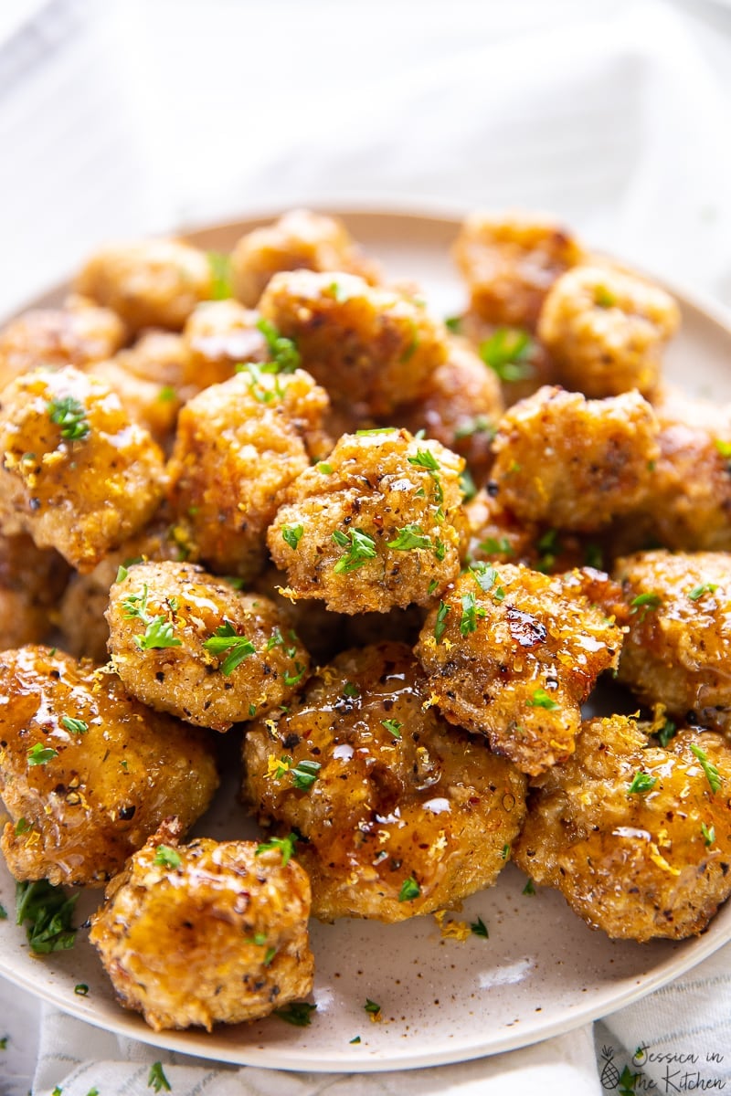 A batch of lemon pepper cauliflower wings on a plate. 