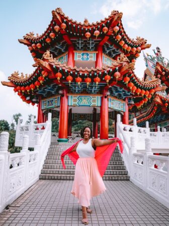 Jessica smiling in front of a pagoda.