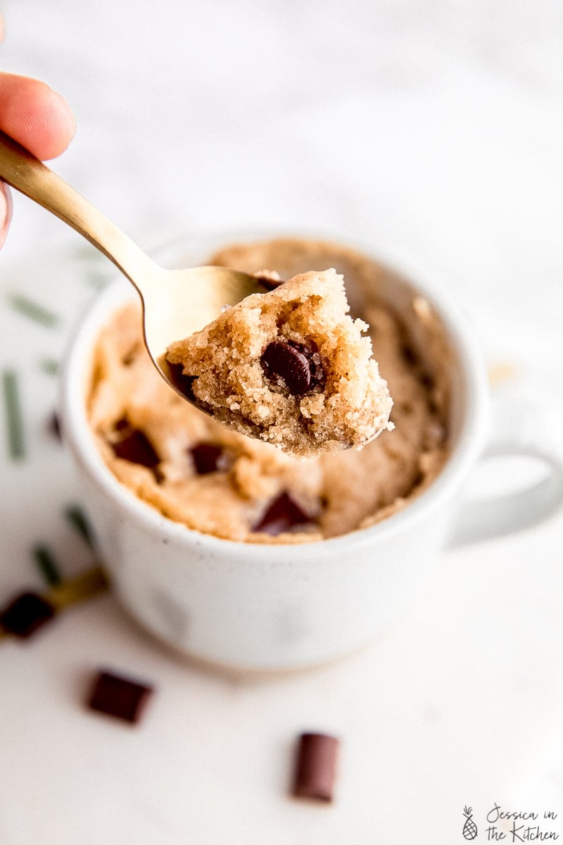 Some chocolate chip mug cake on a spoon.