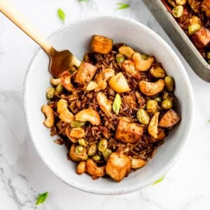 Top down view of vegan fried rice in a blue bowl.