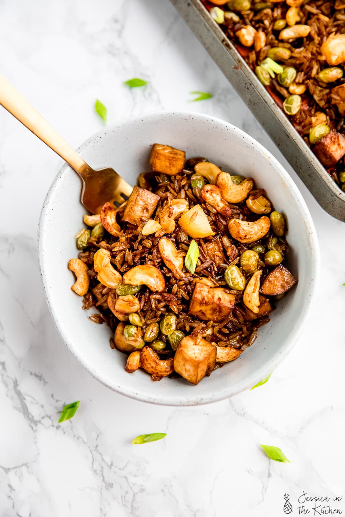 Top down view of vegan fried rice in a bowl.