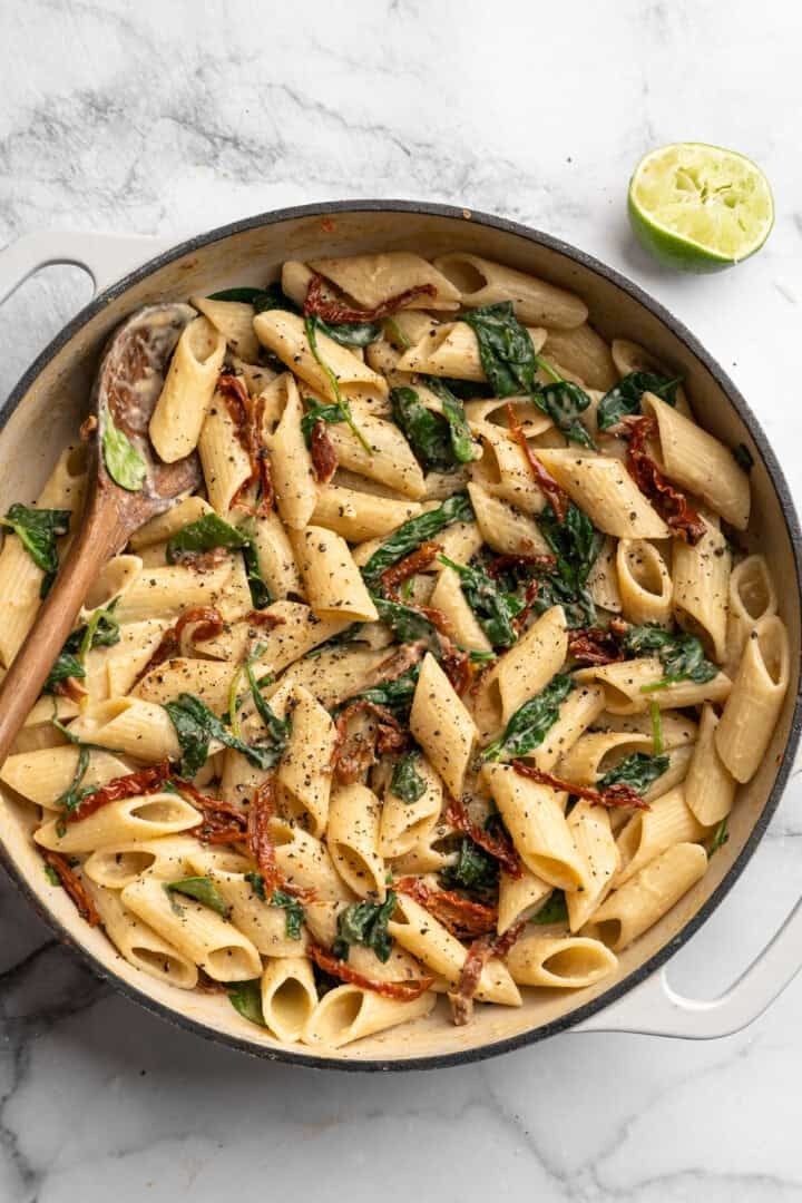 Hummus pasta in Dutch oven with squeezed lime.
