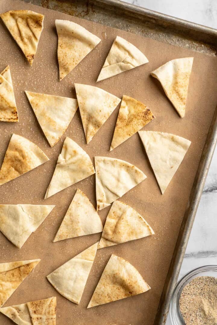 Pita wedges on sheet pan.