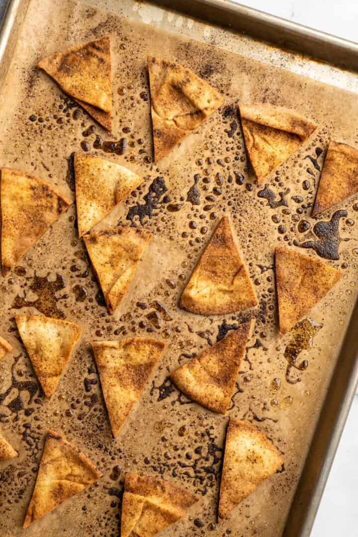 Homemade pita chips on sheet pan.