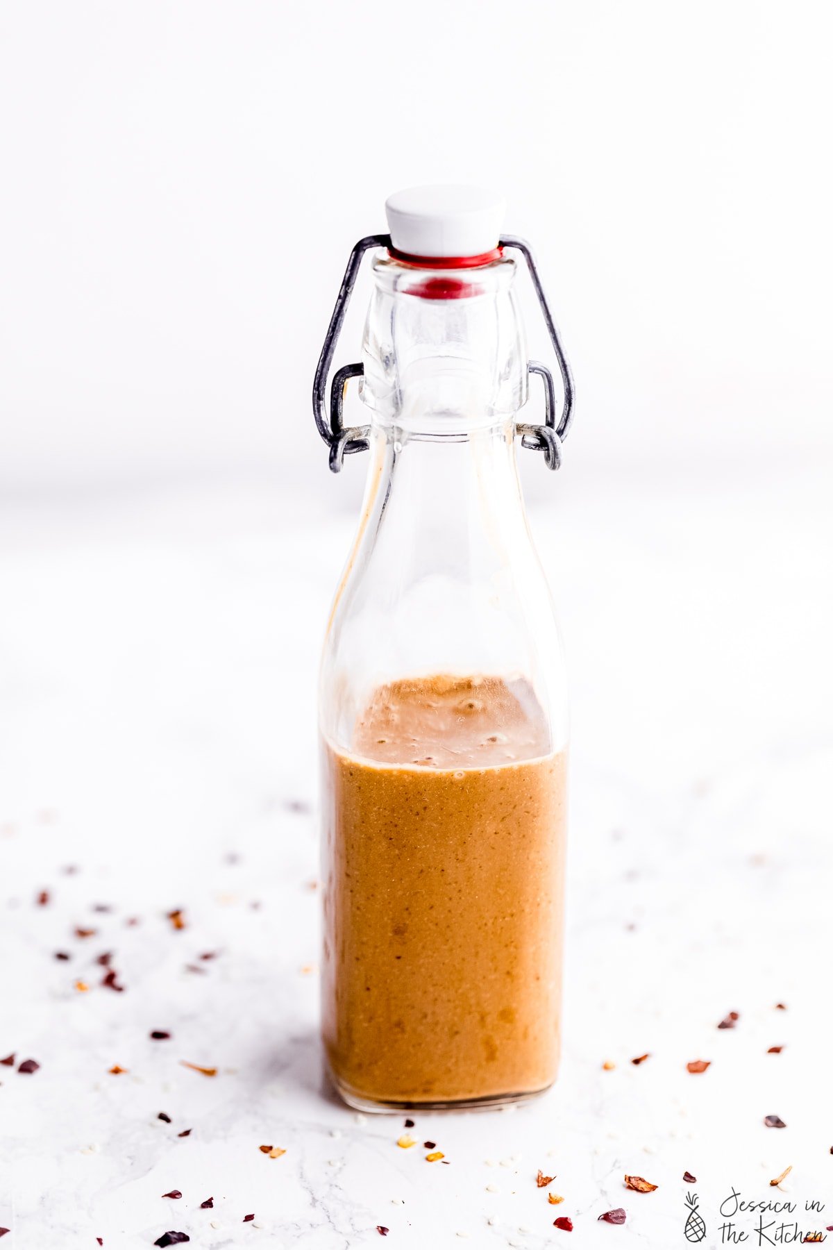 Thai peanut sauce in a sauce bottle.