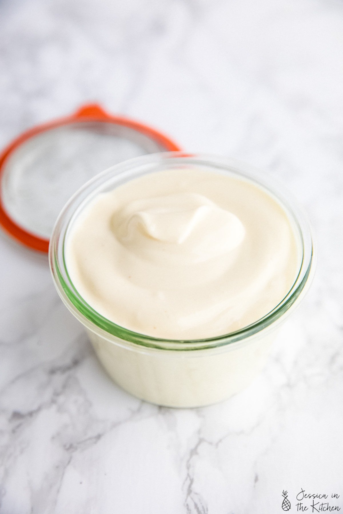 Photo of vegan mayo with a jar.